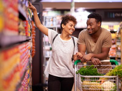 Shot of a young couple shopping in a grocery store